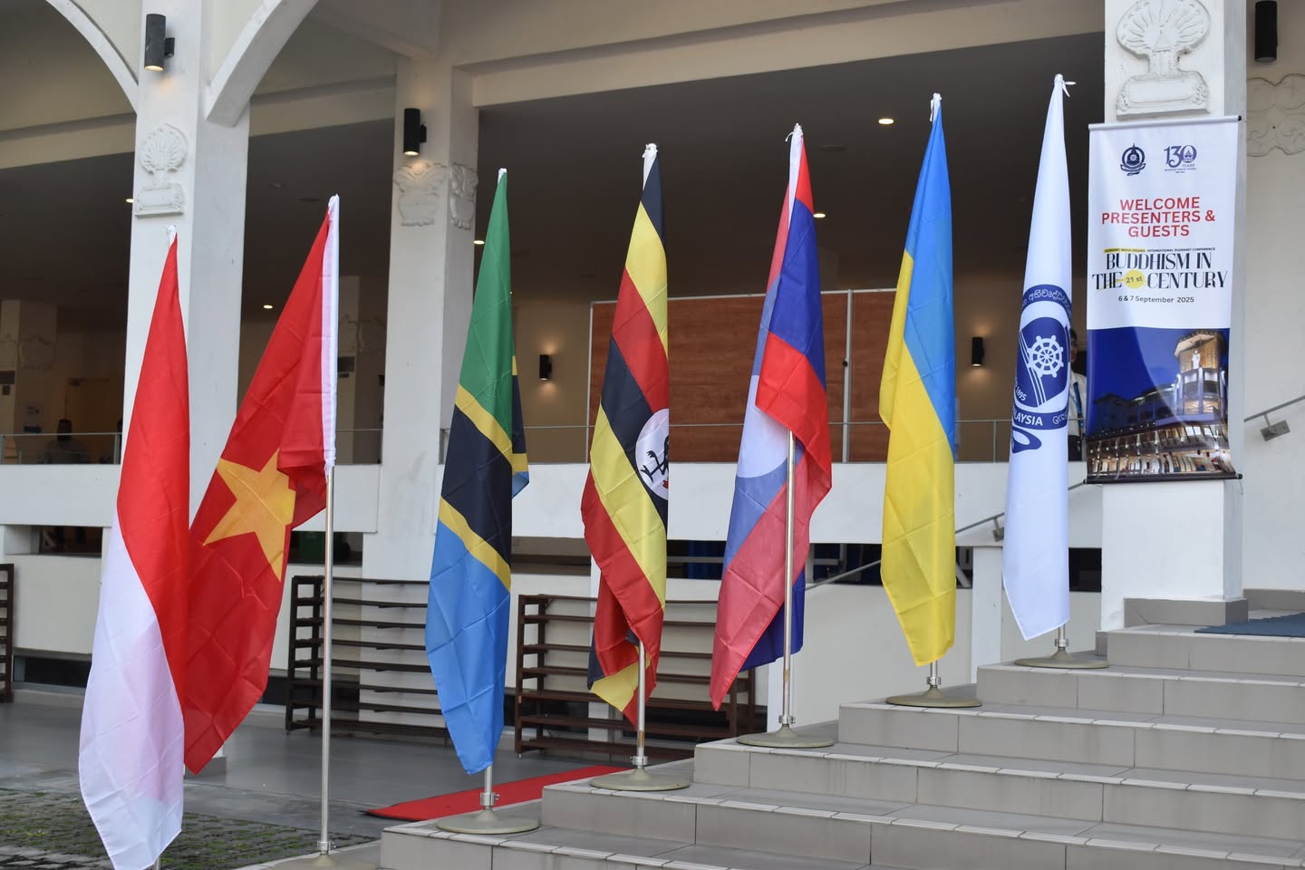 Flags of participating countries, including Ukraine, near the conference venue